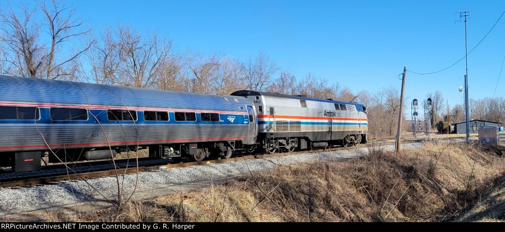 Regional train 156 with heritage 145 in charge enters the west leg of the wye at Lynchburg, taking the train off the ex-N&W from Roanoke to get to the ex-SOU to continue north to Washington and  beyond.  Woodall Rd. Station in background 